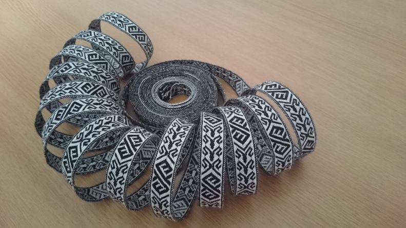 several metres of trim coiled into a shell shape.