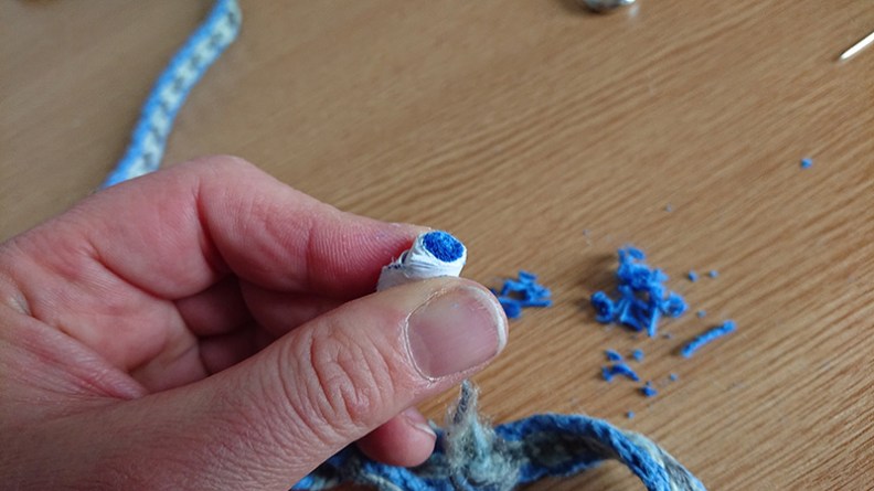 Tassel ends trimmed level with card rolled round tassel